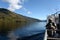 Tourists on the deck of the ship `Pioneer of Altai` watch the views of Lake Teletskoye. Altai Republic