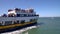 Tourists departing from Fishermans Wharf on a boat tour to Alcatraz Island, San Francisco