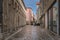 Tourists dining in outdoor restaurants in narrow streets of the old town district, Zadar