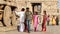 Tourists doing sightseeing ruins of temple in Hampi.