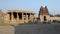 Tourists doing sightseeing ruins of temple in Hampi.