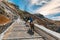 Tourists on donkeys climb the stairs, Fira, Santorini