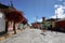 Tourists and donkeys walk the empty streets of Chavin de Huantar in the backcountry of the Andes of Peru