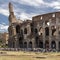 Tourists dwarfed by  the Colosseum, Rome, Italy