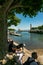 Tourists enjoy a beautiful summer day on the shores of Lake Constance in Konstanz Harbor