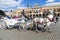 Tourists enjoy a carriage ride at the Market Square in Krakow