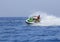 Tourists enjoy driving jetski