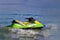 Tourists enjoy driving jetski on the ocean, Space for text. Hot summer time