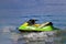 Tourists enjoy driving jetski on the ocean, Space for text. Hot summer time