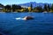 Tourists enjoy a high speed jet boat ride on the Shotover River in Queenstown, New Zealand