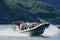 Tourists enjoy the safari tour by speed boat at the Aurlandsfjord in Flam, Norway.