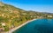 Tourists enjoy summer vacations swimming at Almyros beach in Kato verga seaside town near Kalamata, Greece