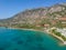 Tourists enjoy summer vacations swimming at Almyros beach in Kato verga seaside town near Kalamata, Greece