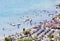 Tourists enjoy sun and watersports in the volcano lake of Castel Gandolfo