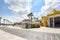 Tourists enjoy a sunny summer day on the waterfront boardwalk at the port city of Brindisi Italy