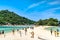 Tourists enjoy themselves on the white sand beach of Nang Yuan islands in Surat Thani, Thailand