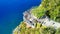 Tourists enjoy the viewpoint at Cabo Girao, along the Madeira coastline, Portugal. Aerial view from drone