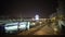 Tourists enjoying night cityscape view during motor boat tour along river