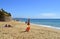 Tourists enjoying sunny weather on Armacao De Pera Beach on the Algarve coast