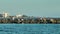 Tourists enjoying vacation time on Nokomis jetty pier in Florida. Seaside summer activities