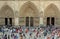 Tourists Entering The Main Doors of Notre Dame Cathedral, Paris