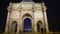 Tourists entering Tuileries Garden through triumphal arch in Place du Carrousel