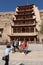 Tourists at the entrance of the Mogao Caves near the city of Dunhuang, in the Gansu Province, China.