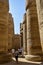 Tourists exploring Egypt. Travel tour group in Karnak Temple. Beautiful Egyptian landmark with hieroglyphics, decayed temples