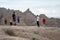 Tourists family explores and enjoys the scenery in Badlands National Park while on summer