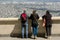 Tourists family look from the mountain to the sights.