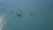 Tourists floating on SUP Board in blue sea. Clip. Top view of group of people on SUP-Boards floating in quiet clear sea