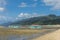 Tourists flock the exposed sand of Laiya Beach during low tide. At San Juan, Batangas, Philippines