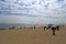 Tourists flying kites on the beach