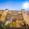 Tourists in front of detail facade of Mosque-Cathedral, Cordoba, Andalusia, Spain, also known as the Mezquita