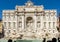 Tourists in front of the magnificent `Trevi Fountain. ` Some take pictures, others do selfies.