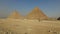 Tourists in front of Menkaure pyramid at Giza