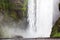 Tourists in front of Skogafoss waterfall