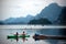 Tourists fun canoeing in Cheow Larn Lake (Ratchaprapa Dam).