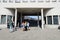 Tourists gather at the gates to the former Oskar Schindler enamel factory in Krakow, Poland