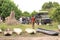 Tourists getting ready for mokoro boat trip on river through okavango delta near maun, botswana, africa.