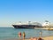 Tourists and a giant yacht at the Mandraki port