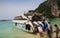 Tourists go aboard a tourist speedboat in Tonsai Bay, Koh Phi Phi Don Island, Thailand