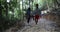 Tourists Group Trekking On Forest Path, Young Diverse Men And Woman On Hike Together