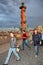 Tourists and guests of St. Petersburg on the spit of Vasilyevsky island