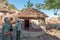 Tourists and guide at reconstructed iron age house at Masorini