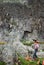 Tourists on a halt under the sheer cliff