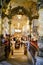 Tourists have afternoon tea in golden hall in New York Cafe in Budapest