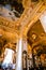 Tourists have afternoon tea in golden hall in New York Cafe in Budapest