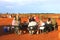 Tourists have a picknick along Uluru Ayers Rock in the red desert, Australia