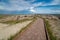 Tourists hike along the boardwalk to the Big Badlands Overlook in Badlands National Park